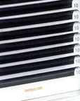 Close-up of Royal L curl lash extensions showing flat base design for maximum retention and natural elevation